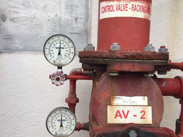 Control valve with pressure gauges on a sprinkler riser