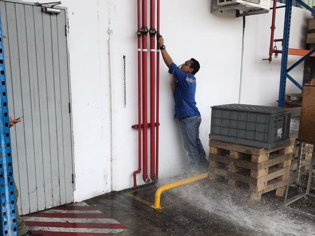 Checking fire main risers during a water flow test